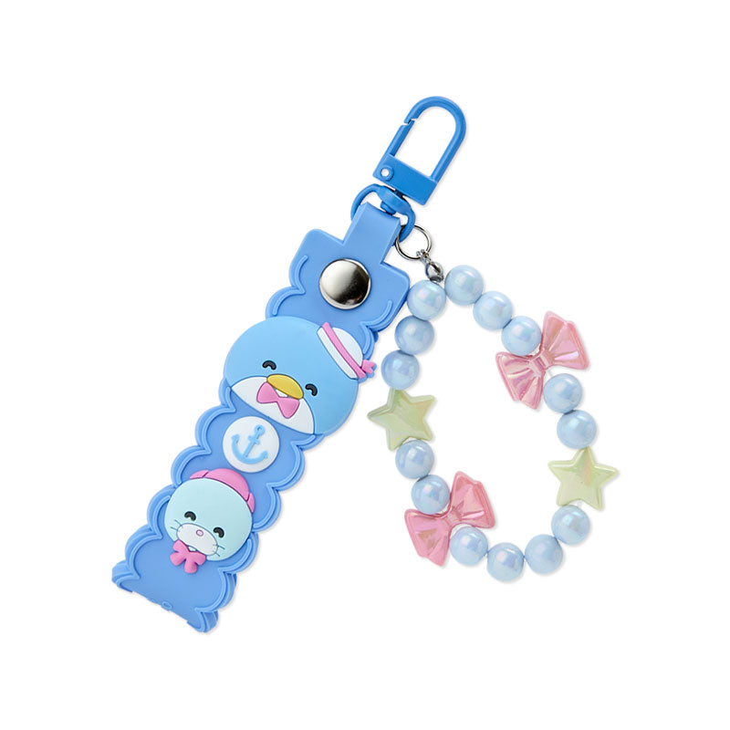 A blue key chain with a penguin design

Description automatically generated