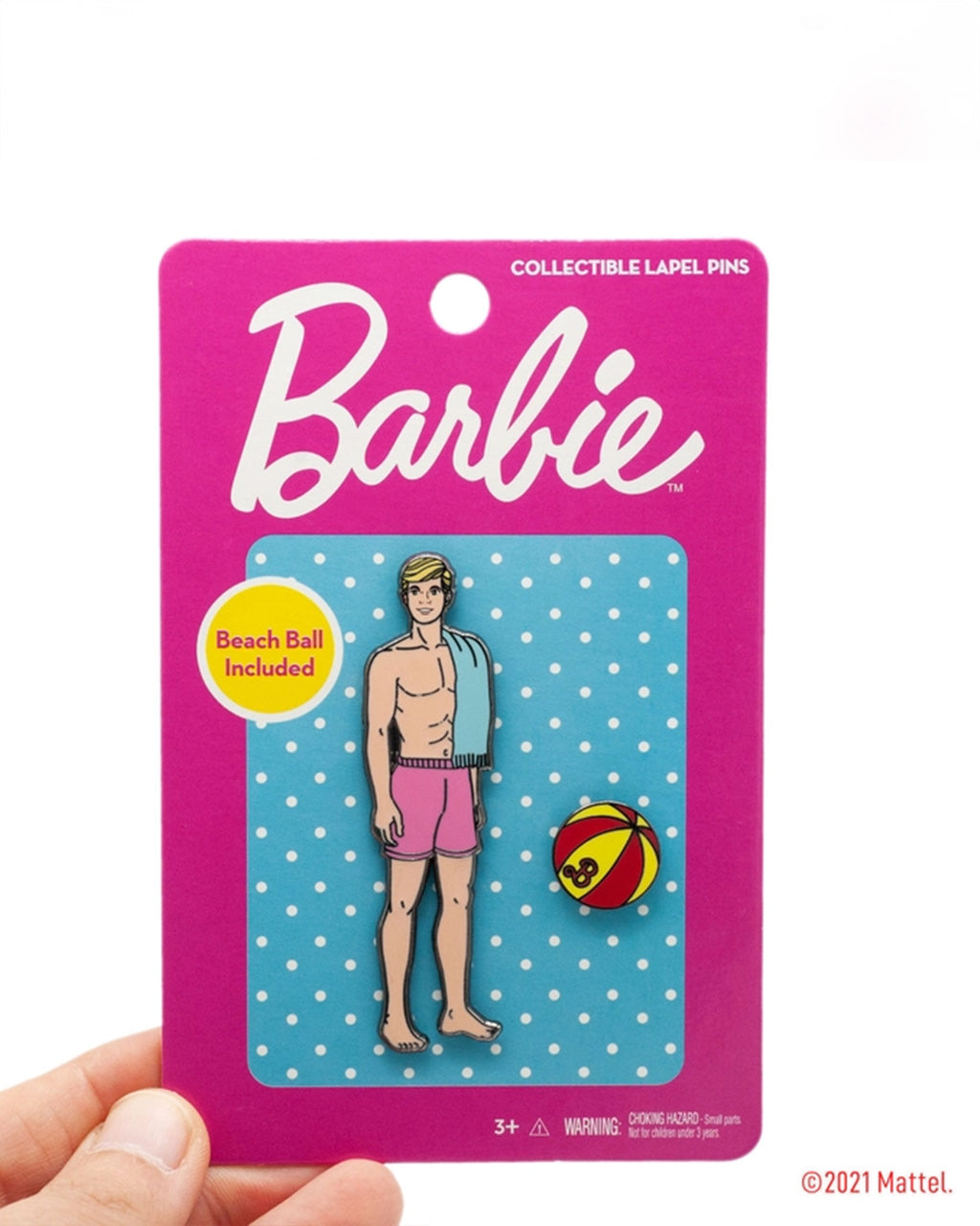 A hand holding a pin with a cartoon person in swimsuit

Description automatically generated